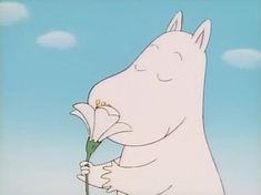 a cartoon character holding a flower in one hand and looking up at the sky behind him