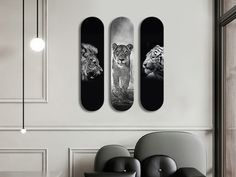 three skateboards mounted to the wall with two lions on one side and another tiger on the other