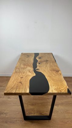 a wooden table sitting on top of a hard wood floor