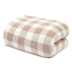 two brown and white checkered towels on top of each other