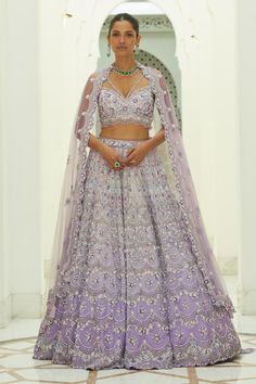 Lilac ombre organza lehenga embroidered in tonal and contrast beads, sequins and crystals in a trellis pattern and attached cancan. Paired with an embroidered padded choli and dupatta. Components: 3 Pattern: Embroidered Type Of Work: Sequin, Bead, Crystal Neckline: Sweetheart Sleeve Type: Sleeveless Fabric: Organza, Satin Color: Purple Other Details:  Attached cancan Padded Blouse Approx. product weight: 7 - 9 kgs Lehenga length: 45 inches Occasion: Wedding, Bride - Aza Fashions Lehenga Purple, Lilac Lehenga, Modern Lehenga, Light Purple Wedding, Sweetheart Bridal, Organza Lehenga, Bridal Lehenga Red, Padded Blouse, Lehenga Wedding