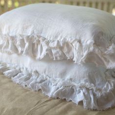 two white pillows stacked on top of each other