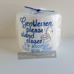 a white toilet paper with blue writing on it