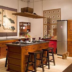 a kitchen with an island and two stools