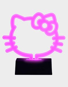 an illuminated hello kitty head on a black stand