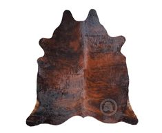 a brown cowhide rug on a white background