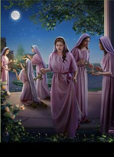 three women dressed in pink robes are standing outside at night with the moon behind them