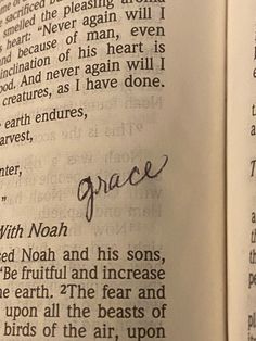 an open book with the word grace written in cursive writing