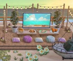 a computer screen sitting on top of a wooden dock next to flowers and plants in front of the ocean