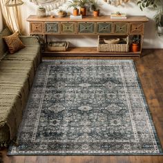 a living room with a couch and rug