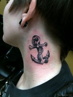 a man with a tattoo on his neck has an anchor and skull behind the ear