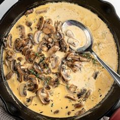 a skillet filled with mushrooms and cheese