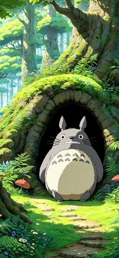 the cartoon totoro is sitting in front of a tree