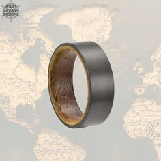 an image of a ring with wood in it on a world map background that says atlas african design