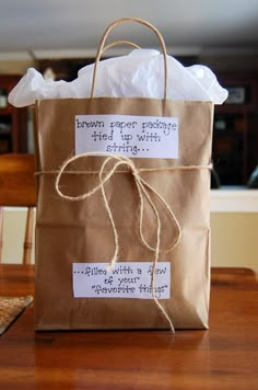 a brown bag with some writing on it and a tag that says, bag of his favorite things i diy valentine's for boyfriend