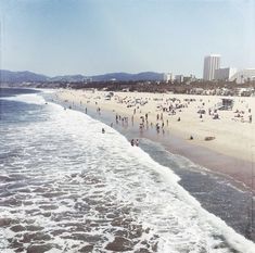 many people are on the beach and in the water at this point, there is no image here to provide a caption for