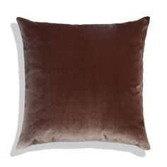 a brown pillow on a white background