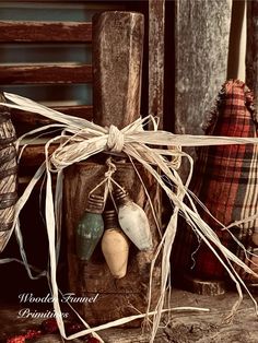 an old fashioned wooden box with some items tied to it