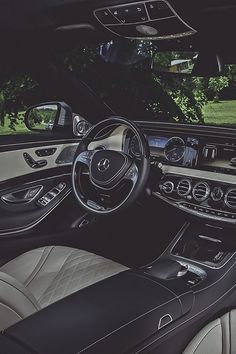 the interior of a mercedes s - class coupe with leather and chrome trims is shown