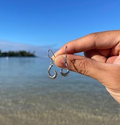 Waikiki is renowned for its gentle rolling waves and vibrant beach culture. The fish hook design symbolizes the rich fishing traditions of Hawaii, where anglers skillfully navigate the deep blue waters for big game fish. These earrings reflect that spirit, making them a meaningful addition to any jewelry collection. Features: *Material: Premium 925 sterling silver for lasting shine and durability. *Handmade:  pair is meticulously crafted to ensure uniqueness and high quality. *Lightweight: Desig Beach Culture, Thoughtful Gifts For Her, Hawaiian Jewelry, Hook Design, Fish Hook Earrings, Big Game, Fish Hook, Hook Earrings, Earrings Jewelry