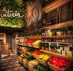 the inside of a grocery store filled with lots of fresh fruits and vegetables on shelves