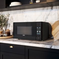 a black microwave oven sitting on top of a counter