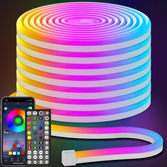 an image of a remote control next to a rainbow colored led strip with the app on it