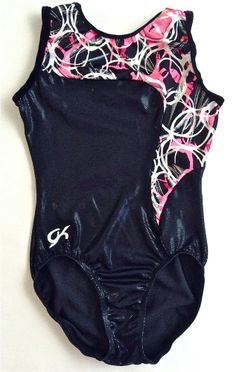 a women's black and pink swimsuit with white swirls on the back