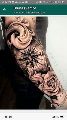 a woman's arm with roses and compass tattoo on her left arm, in black and white