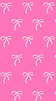 a pink background with white bows on it