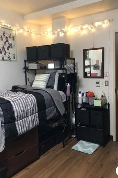 a bedroom with a bed, dresser and other items on the floor in front of it