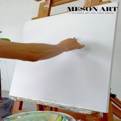 a person is drawing on a white board