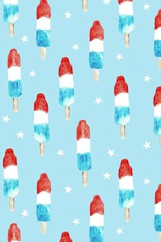 watercolor popsicles with red, white and blue ice cream on them against a light blue background