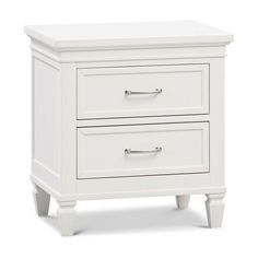 a white night stand with two drawers on each side and an open drawer at the bottom