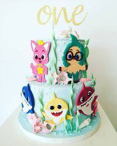 there is a cake decorated with cartoon characters on it