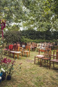 many chairs and tables are set up in the yard