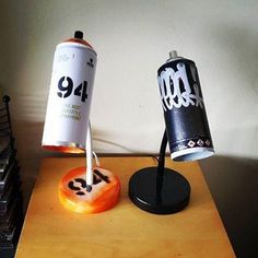 two soda cans are sitting on a table