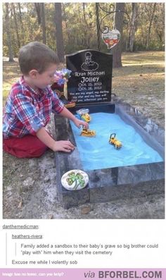 a young boy is playing with toys in the ground