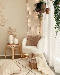 a living room with a chair, rug and lights on the wall next to it