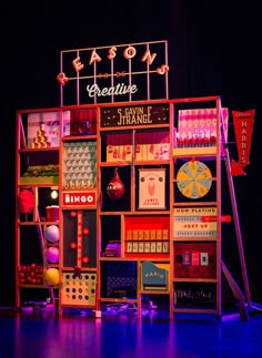 the stage is set up for a show with neon signs and decorations on it's walls