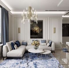 a living room filled with furniture and a chandelier