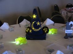 the table is set with yellow and green decorations