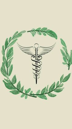 a medical symbol with green leaves around it