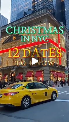 a yellow taxi driving past a tall building with christmas lights on it's side