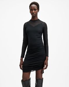 The Adara Dress brings a touch of femininity to our dark color palette this season. Made from polka dot tulle fabric, it's got a high neck, long sleeves and is shaped to a bodycon fit. Complete with a lace trim around the neck and gathered side seams – they're adjustable, style it your way.   This dress is designed to a bodycon fit Pullover High neck Long sleeves Mini-length Polka dot tulle Lace trims Gathered side seams – adjustable with a grosgrain tape. Lightweight Tulle Mini Dress, Mini Dress Black, Skirt Co Ord, Lace Trims, High Neck Long Sleeve, Tulle Fabric, Dark Color, Tulle Lace, Guest Outfit