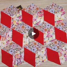 a video demonstrating how to make a quilted hexagonal pattern with red and white squares