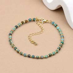 This delicate beaded bracelet features vibrant turquoise beads interspersed with gold-toned accents, creating a refined and elegant look. The adjustable clasp ensures a comfortable fit for any wrist size. Ideal for adding a subtle pop of color to your everyday outfit or layering with other pieces for a more personalized style. Turquoise bead design Gold chain detail Adjustable size Lobster claw closure Size: length 21cm (8.26inch) Brown Contact Lenses, Green Contacts Lenses, Purple Contacts, Green Contacts, Everyday Outfit, Dress For Short Women, Bead Designs, Turquoise Beads, Lobster Claw