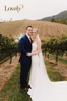 a bride and groom posing for a photo in front of a vineyard with the words lovely?