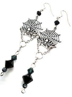 Made to Order! This earring set features a spider on its web. Perhaps it is reeling in its tangled prey? They can be worn with Gothic, fantasy inspired, steampunk or any other outfits you wish. This elegant design is the perfect pair with one of my necklaces or rosary chains! They also go really well with layers of stacked silver statement necklaces. These earrings make a perfect gift for someone who loves spiders and insects or ornate silver toned jewelry. Each earring weighs approx. .2 oz. ﻿Th Handmade Punk Style Costume Jewelry, Punk Style Handmade Costume Jewelry, Steampunk Jewelry For Halloween Cosplay, Fantasy Dangle Earrings For Halloween, Halloween Fantasy Dangle Earrings, Fantasy Halloween Dangle Earrings, Gothic Metal Earrings For Halloween, Halloween Fantasy Earrings For Pierced Ears, Fantasy Metal Earrings For Halloween