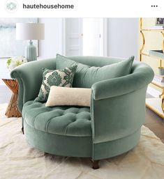 a green chair sitting on top of a white rug